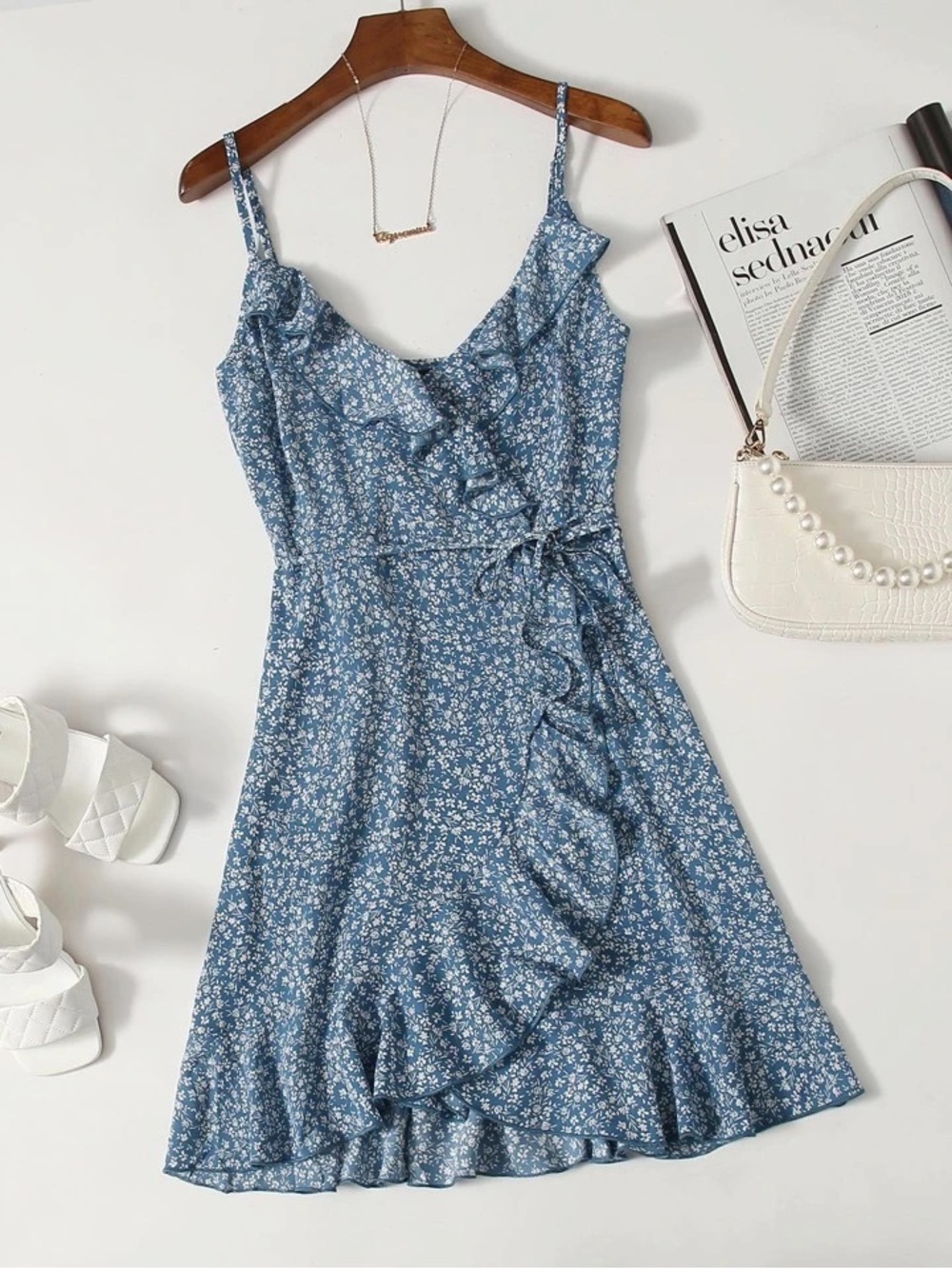 Blue Ruffle Dress with White Floral Pattern and Tie in Front. Size Large.